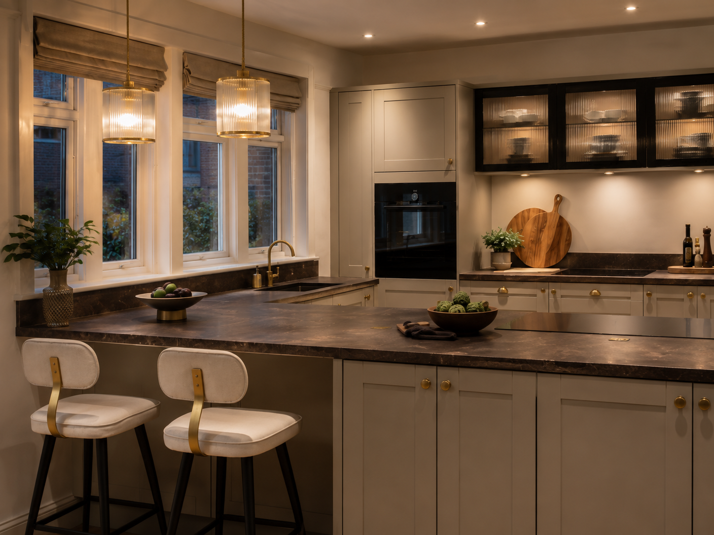 Warm-toned bespoke kitchen with dark stone worktops and brass pendants — Evening Warm — Dominus Design Bespoke Luxury Kitchens London | Vxro.pl