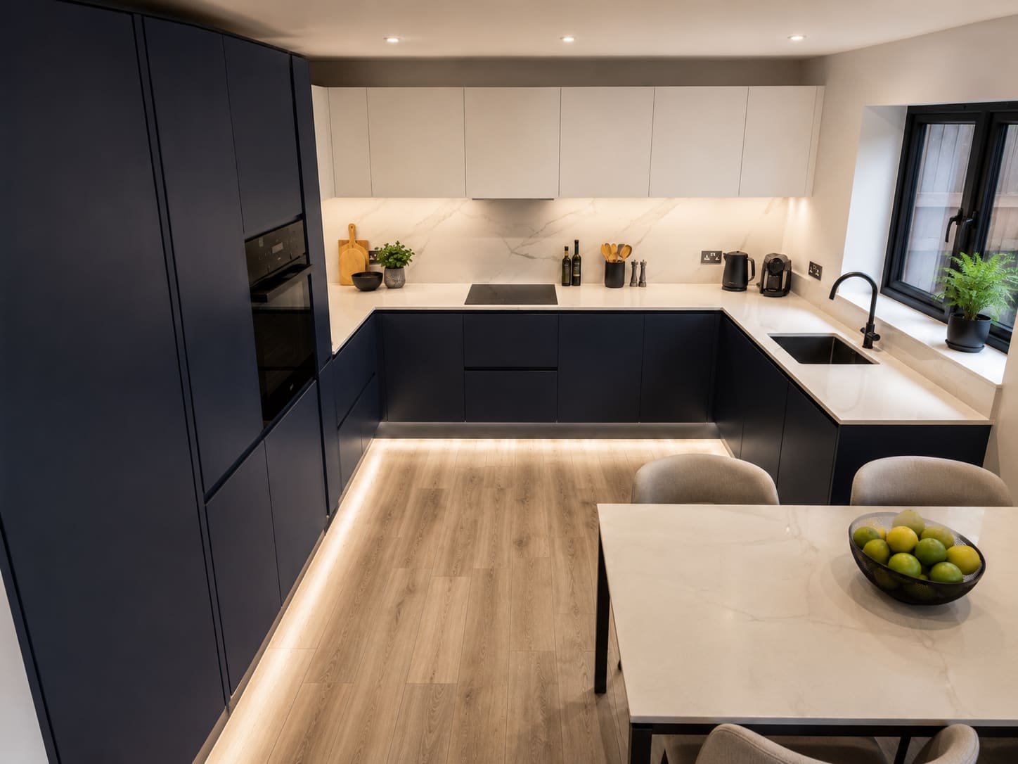 Bespoke marble island kitchen with painted perimeter cabinetry