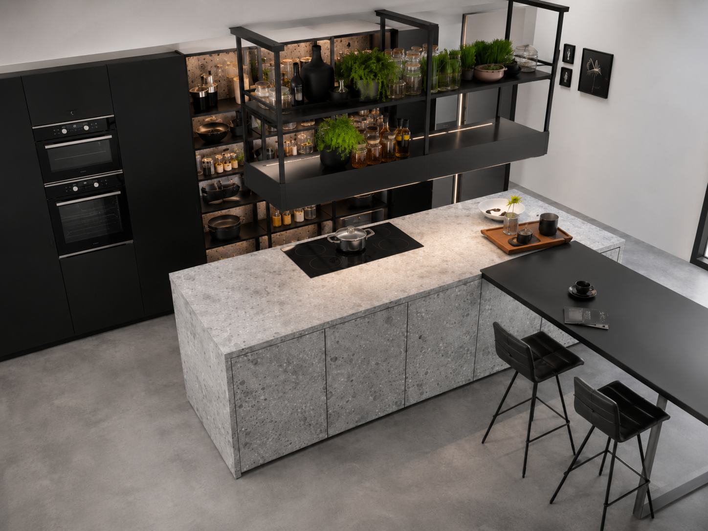 Concrete-clad island with blackened steel shelving and garden view