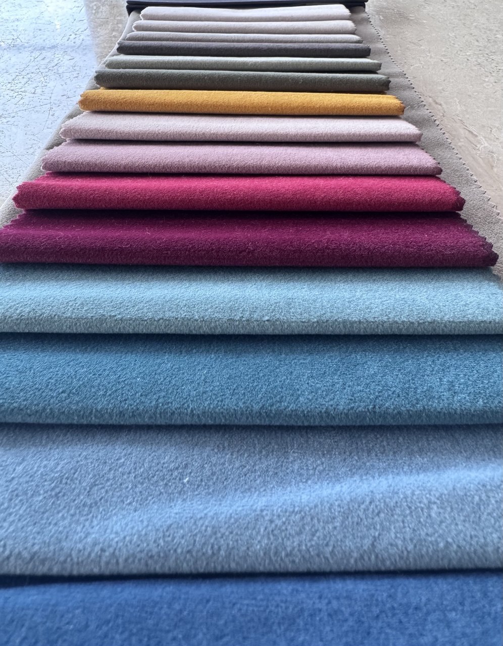 Stacked bouclé and textured weave sofa fabric samples