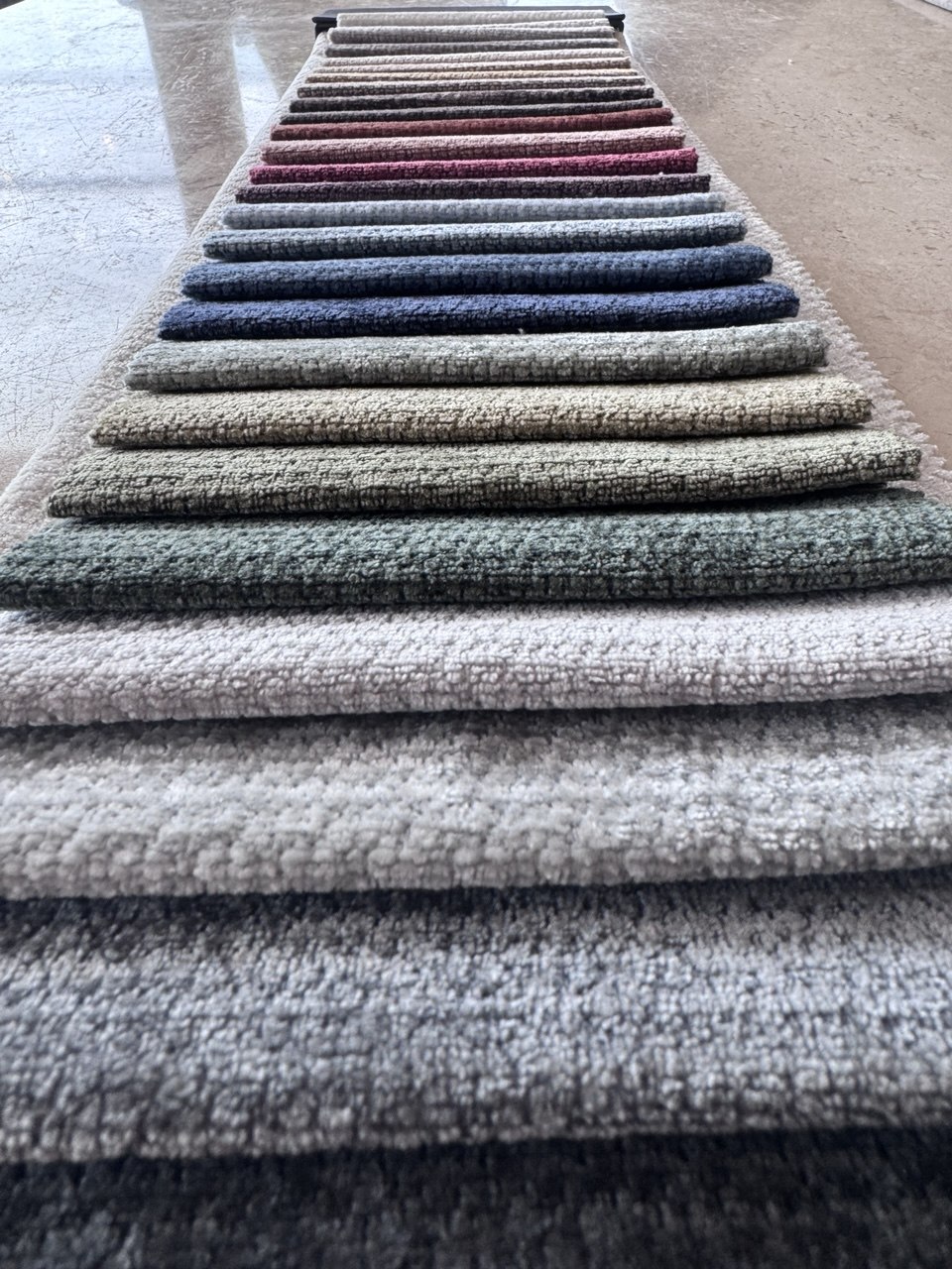 Warm earth tone upholstery fabric swatches for bespoke sofas