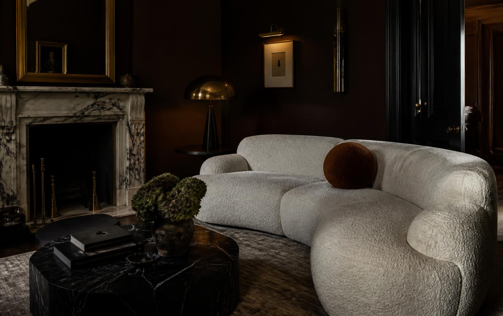 Bespoke bouclé sofa in a dark London townhouse living room by Dominus Design